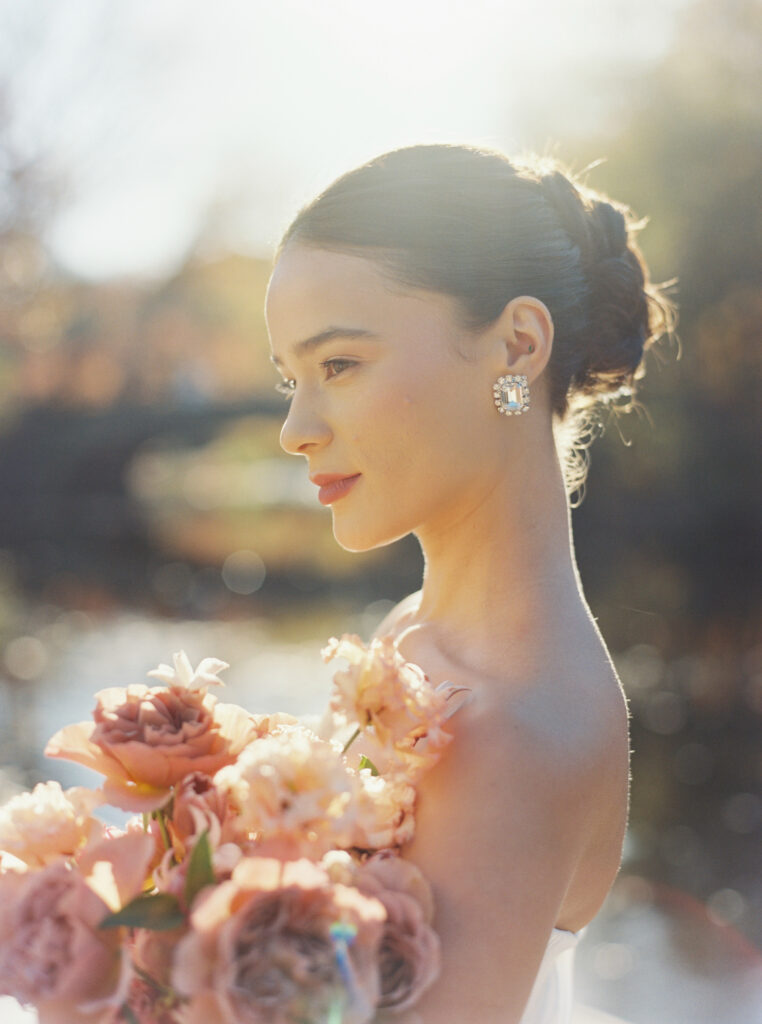 Close-up bridal portrait with soft golden light and blush bouquet at Purslane at the Boathouse, captured by Lexie Vaccaro Photography

